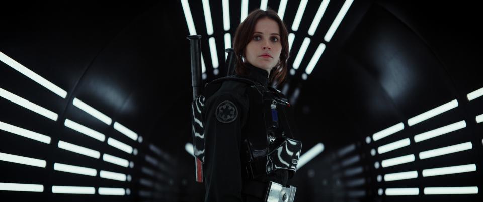 <p>Now grown, the spunky Jyn (Felicity Jones) is abducted by the Rebel Alliance as a means of getting to her father. Jyn hopes to steal Death Star plans before the station can wreak havoc on innocent planets and render the rebellion obsolete. (Photo: Lucasfilm) </p>