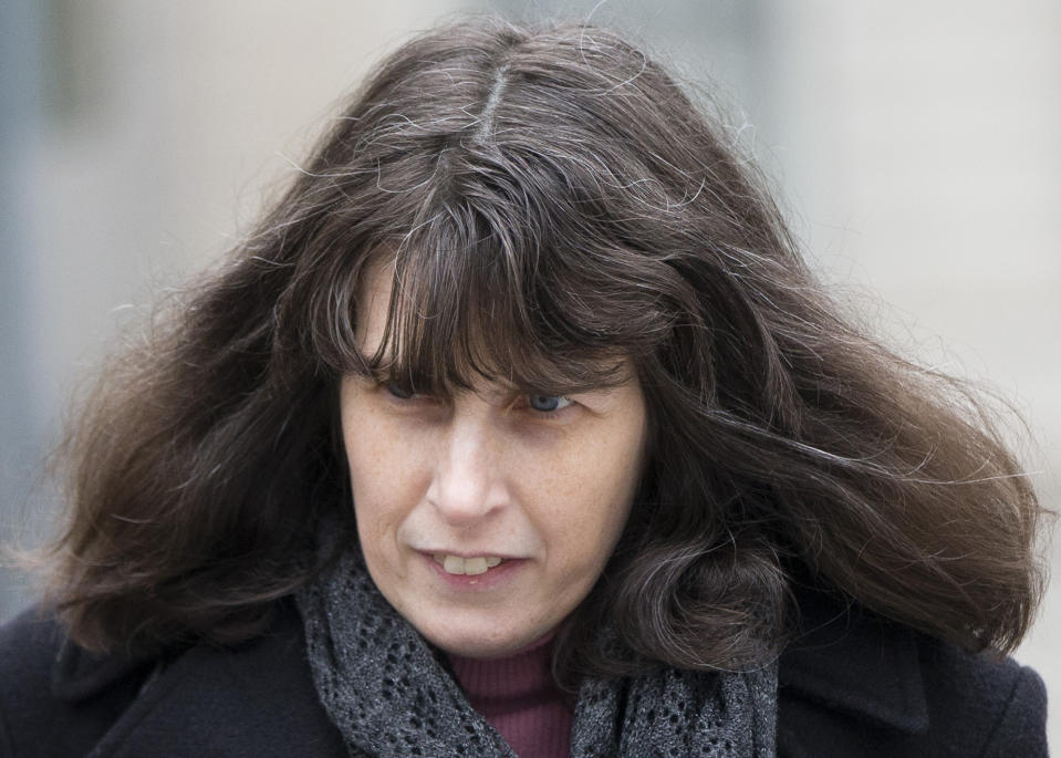 Catherine Schaible walks from the criminal justice center Wednesday, Feb. 19, 2014, in Philadelphia. Herbert and Catherine Schaible who believed in faith-healing were sentenced Wednesday to 3.5 to seven years in prison in the death of a second child who was sick but didn't see a doctor. Philadelphia Common Pleas Judge Benjamin Lerner told Herbert and Catherine Schaible that it wasn't 8-month-old Brandon's time to die.(AP Photo/Matt Rourke)