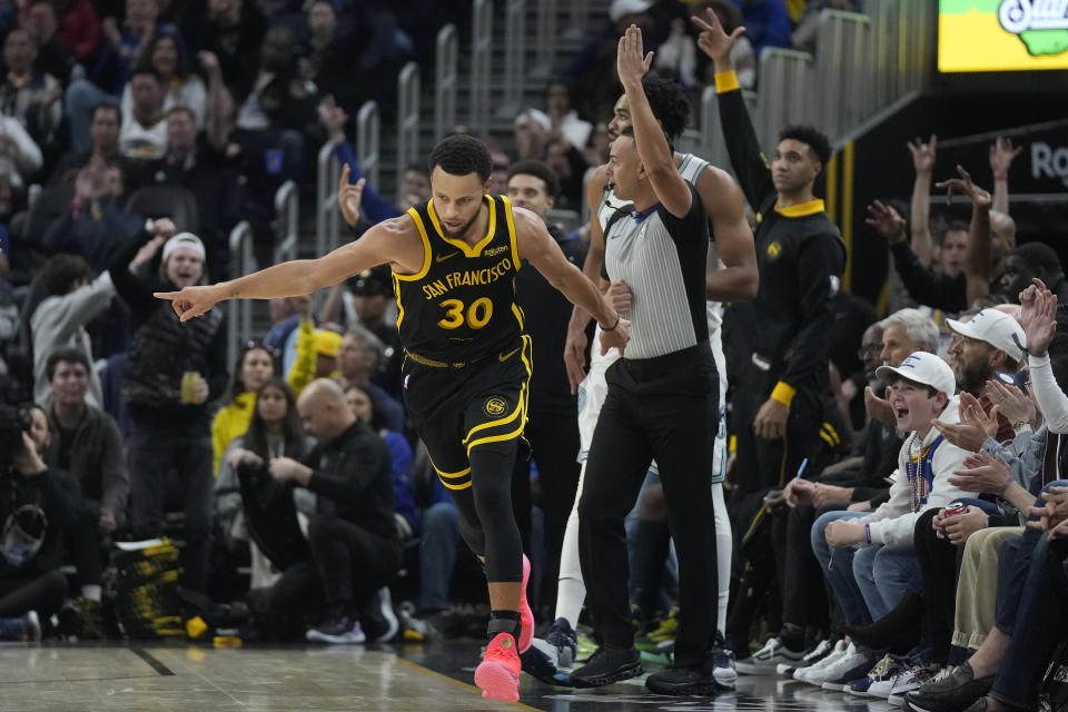 Golden State Warriors guard Stephen Curry (30) gestures after making a 3-point basket against the Minnesota Timberwolves during the first half of an NBA basketball game in San Francisco, Sunday, Nov. 12, 2023. (AP Photo/Jeff Chiu)