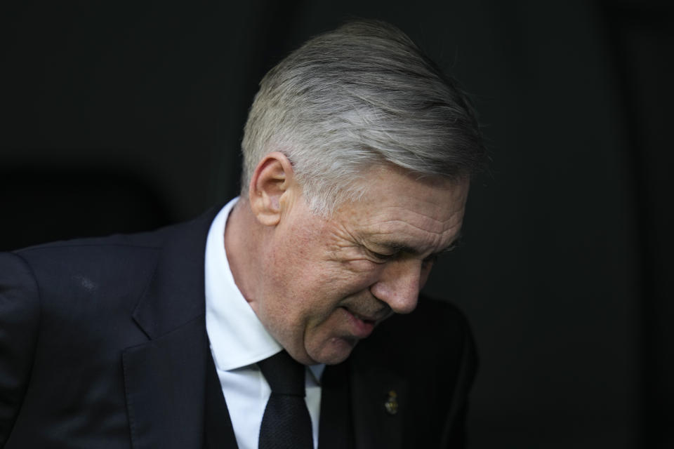 Real Madrid's head coach Carlo Ancelotti arrives for a Spanish La Liga soccer match between Real Madrid and Espanyol at the Santiago Bernabeu stadium in Madrid, Spain, Saturday, March 11, 2023. (AP Photo/Bernat Armangue)