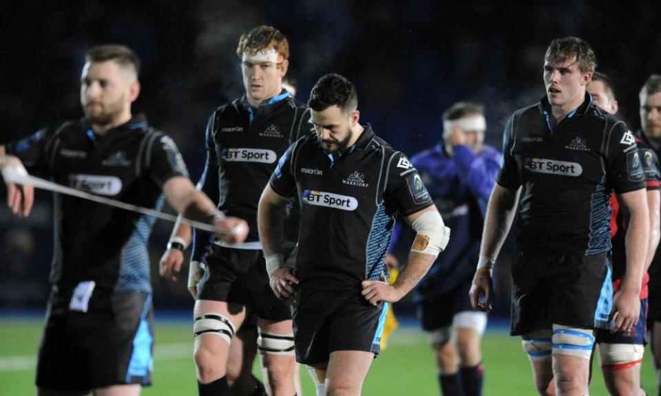 Glasgow players react after the agonising defeat to Munster at Scotstoun.