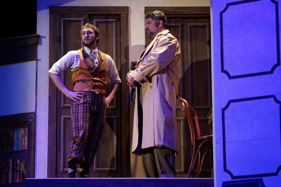 Maxwell Lam as Thomas Colleymore and Jared Hoffert as the police inspector discuss the murder of Charles Haversham, a character in the play-within-a-play "The Murder at Haversham Manor," in "The Play That Goes Wrong."