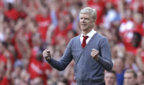 <p>Arsenal’s French manager Arsene Wenger celebrates his side’s second goal during the English Premier League soccer match between Arsenal and Burnley at the Emirates Stadium in London, Sunday, May 6, 2018. The match is Arsenal manager Arsene Wenger’s last home game in charge after announcing in April he will stand down as Arsenal coach at the end of the season after nearly 22 years at the helm. (AP Photo/Matt Dunham) </p>