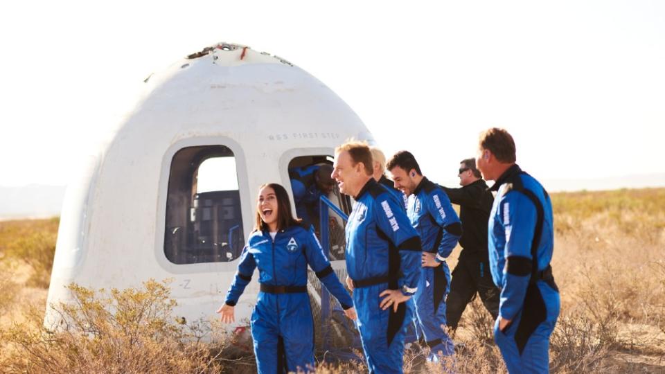 Back to Earth. The crew celebrate touchdown after a 10-minute voyage beyond the Karman Line. - Credit: Courtesy Blue Origin