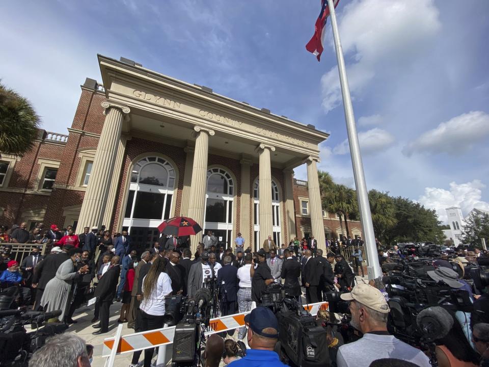 Hundreds of pastors rally during the trial of Greg McMichael and his son, Travis McMichael, and a neighbor, William "Roddie" Bryan outside the Glynn County Courthouse, Thursday, Nov. 18, 2021, in Brunswick, Ga. The three are charged with the February 2020 slaying of 25-year-old Ahmaud Arbery. (AP Photo/Stephen B. Morton)