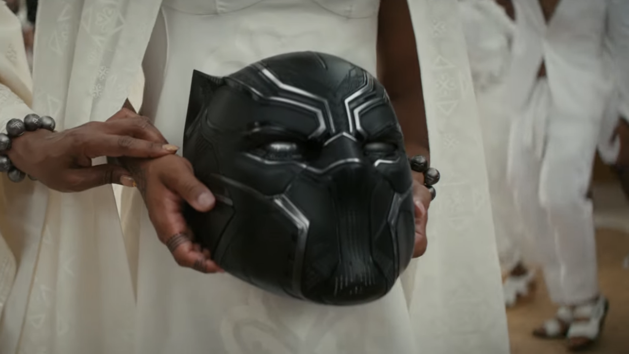  Shuri holding T'Challa's helmet in Black Panther 2 