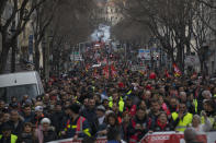 Protesters march during a demonstration in Marseille, southern France, Friday, Jan. 24, 2020. French unions are holding last-ditch strikes and protests around the country Friday as the government unveils a divisive bill redesigning the national retirement system. (AP Photo/Daniel Cole)