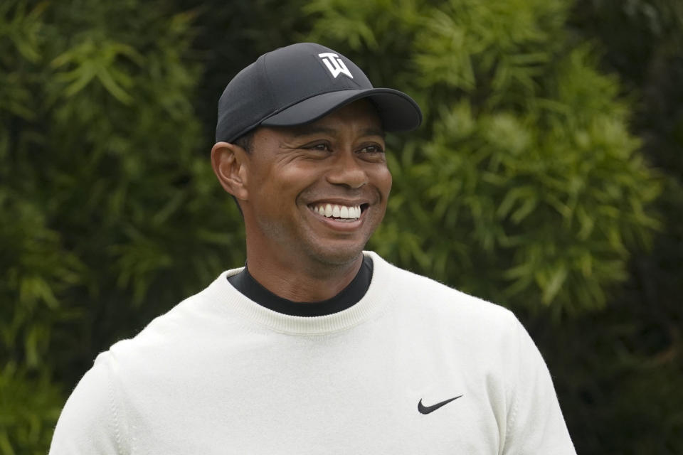 FILE - In this June 12, 2019, file photo, Tiger Woods smiles on the 12th hole during a practice round for the U.S. Open golf tournament in Pebble Beach, Calif. Woods will take part in a Japan Skins game on Oct. 21 that will be shown live worldwide by Discovery-owned GOLFTV. (AP Photo/David J. Phillip, File)