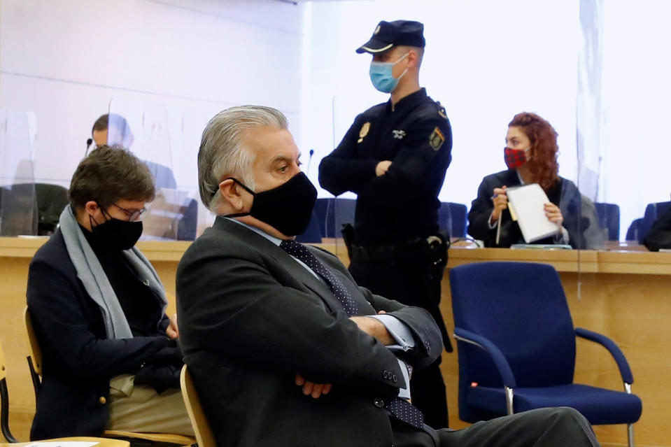 Former Popular Party treasurer Luis Barcenas, sits in the National Court in San Fernando de Henares, just outside of Madrid, Spain, Monday Feb. 8, 2021. A court in Spain has begun a high-stakes trial that has brought back the attention on the illegal funding scheme that has been hunting Spain's Popular Party, in a case that casts a long shadow on the country's polarized politics. (Ballesteros, Pool Photo via AP)