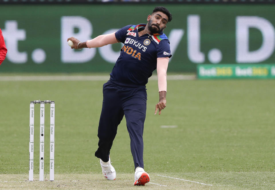 FILE - In this Nov. 29, 2020, file photo, India's Jasprit Bumrah bowls during the one day international cricket match between India and Australia at the Sydney Cricket Ground in Sydney, Australia. The paceman with the unorthodox bowling action is back to spearhead India's T20 attack for the first time since the coronavirus outbreak and is likely to become the country's leading wicket-taker in the format during the World Cup. (AP Photo/Rick Rycroft, File)