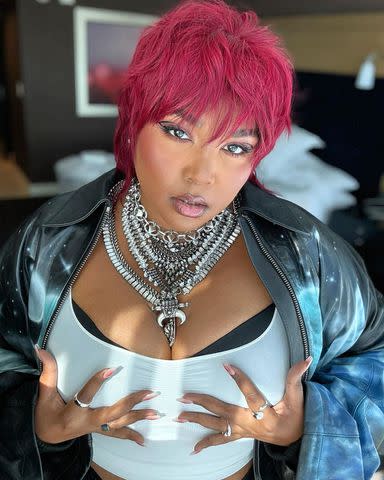 Lizzo Plays Up Her Edgy 2024 Super Bowl Outfit with Fishnet Stockings and a  Fiery Red Mullet - Yahoo Sports