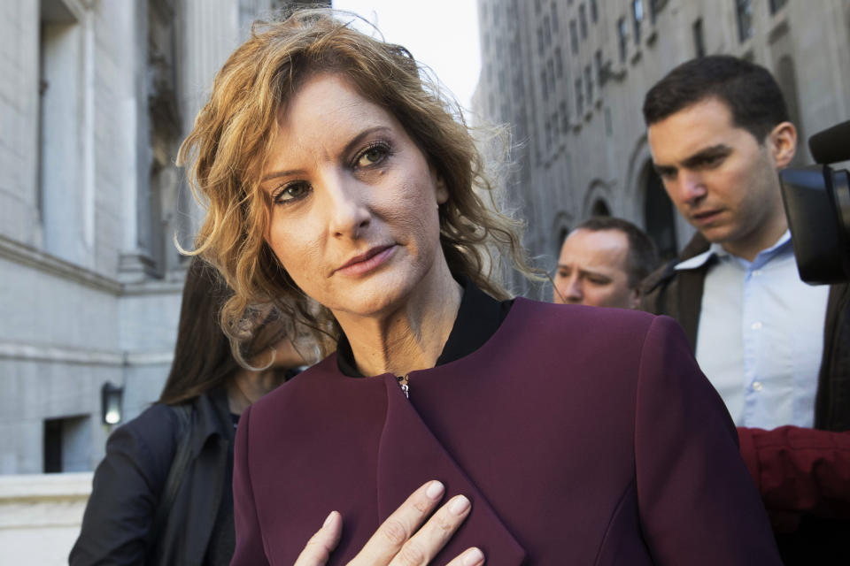 FILE - In this Oct. 18, 2018, file photo, Summer Zervos leaves New York state appellate court in New York. Records filed in Zervos' defamation suit and obtained Monday, Nov. 4, 2019, by The Associated Press indicate that Zervos, a former "Apprentice" contestant, got a call from Trump's phone on Dec. 21, 2007, when she says he rang to invite her to dinner. She says she went for career advice and was sexually assaulted. Trump lawyer Marc Kasowitz said Monday that Zervos' claims "are entirely meritless and not corroborated by any documents." (AP Photo/Mary Altaffer, File)