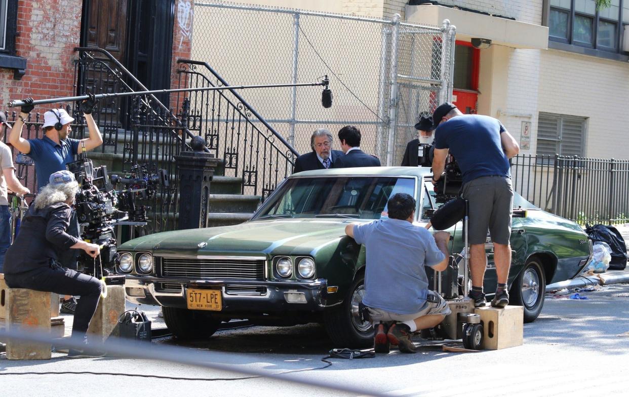 Al Pacino braves and co-star Logan Lerman film scenes for the upcoming Amazon series "The Hunt" in Manhattan's Chinatown area on Sunday, July 28, 2019. Pacino was all smiles as crew members tried to keep him cool with cooling fans and lots of water.