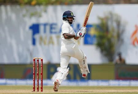 Cricket - Sri Lanka v India - First Test Match - Galle, Sri Lanka - July 26, 2017 - India's cricketer Shikhar Dhawan plays a shot. REUTERS/Dinuka Liyanawatte