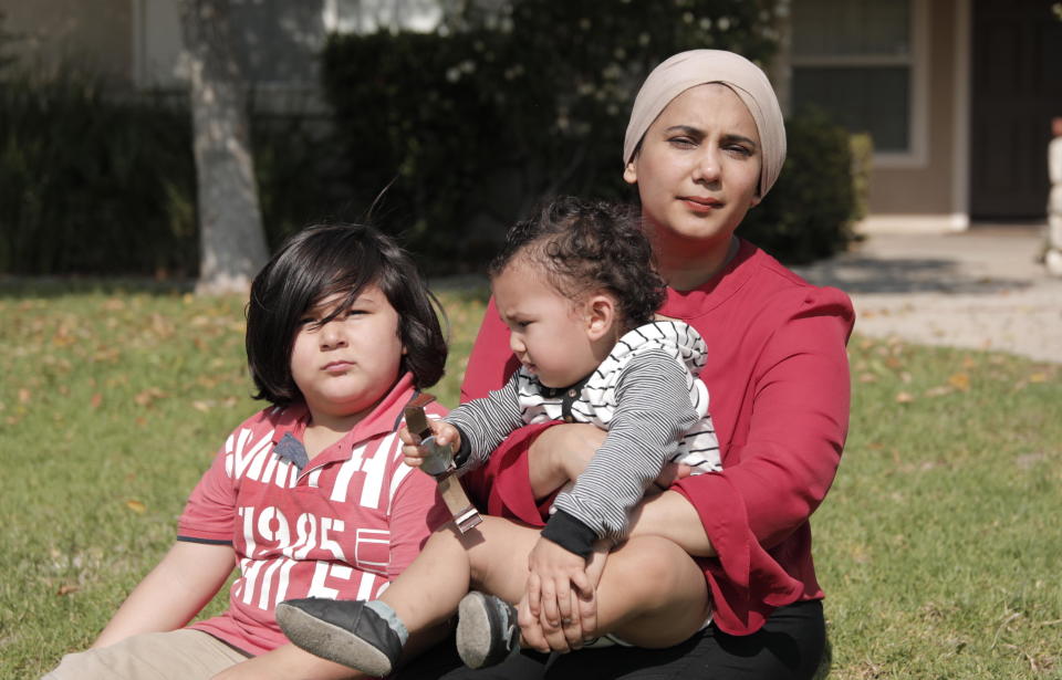 Urooj Alavi poses for a photo with her toddler, Abbas, 1, and Orlando, 6. / Credit: Wey Wang / ACLU