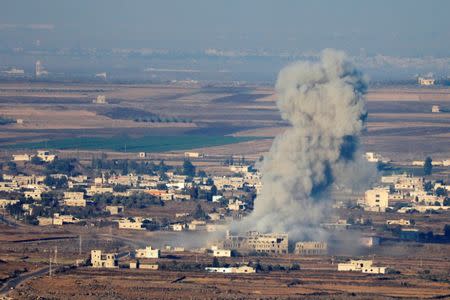 Smoke following an explosion in Syria is seen from the Israeli-occupied Golan Heights near the Israeli Syrian border July 16, 2018. REUTERS/Ronen Zvulun