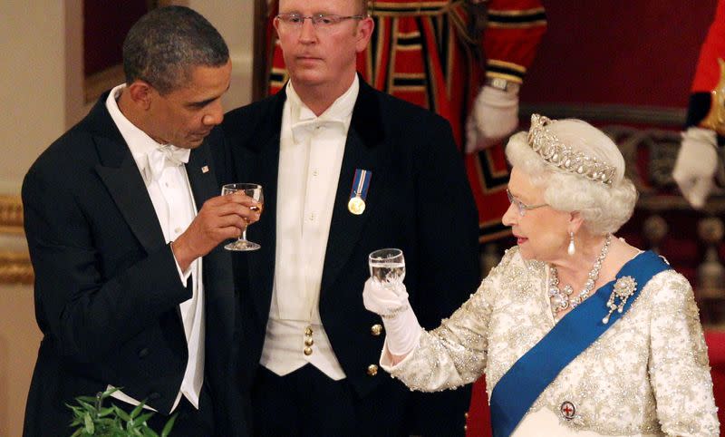 FILE PHOTO: Queen Elizabeth and U.S. President Barack Obama toast during a State Banquet in Buckingham Palace in London