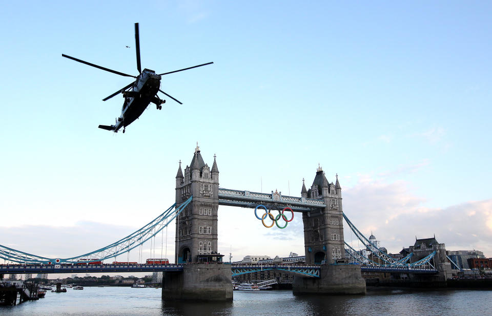 LONDON, ENGLAND - JULY 20: The Olympic flame arrives in London onboard a Sea King Helicopter during the London 2012 Olympic Torch Relay on July 20, 2012 in London, England. The Olympic Flame is now on day 63 of a 70-day relay involving 8,000 torchbearers covering 8,000 miles. (Photo by Jan Kruger/Getty Images)