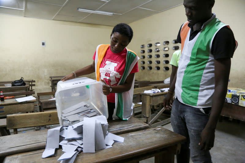 Election officials start to count the ballots during the presidential election in Abidjan