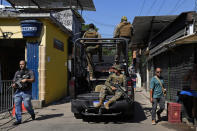 Military police occupy the Jacarezinho favela in Rio de Janeiro, Brazil, Wednesday, Jan. 19, 2022. Military police started to occupy the favela as the first phase of Rio de Janeiro state government's new program against organized crime and promises of social interventions. (AP Photo/Silvia Izquierdo)