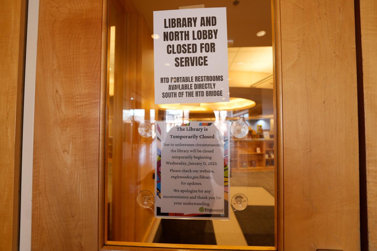 Signs are placed on the outside doors to advise visitors that the library as well as a restroom are closed because of meth contamination Thursday, Jan. 12, 2022, in the south Denver suburb of Englewood, Colo.