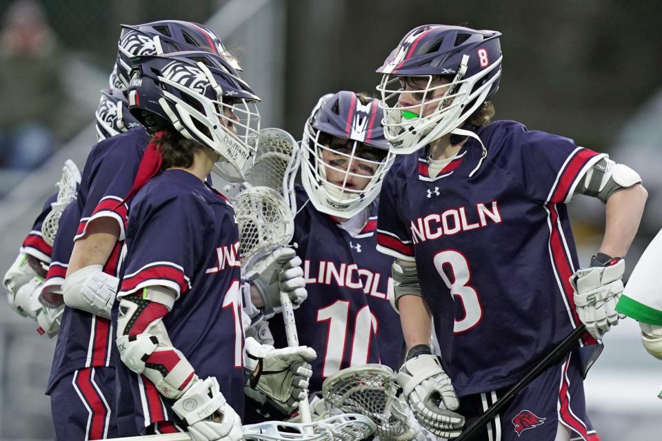 Lincoln's Luke Richards celebrates with teammates after scoring the first goal of the game against North Smithfield on Wednesday night.