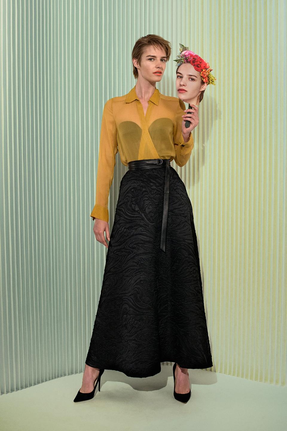 Yellow crinkle chiffon blouse; zip-back bustier with striped quilting on bust section and transparent corset; embossed black circle skirt; leather wrap belt