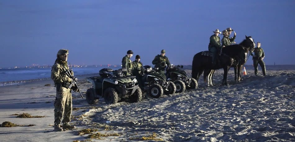 U.S. Border Patrol agents stand vigil at the border with Mexico on November 16, 2018 in San Diego, CA, as seen from Tijuana, Mexico.