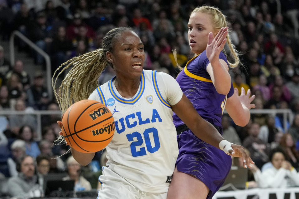 UCLA guard Charisma Osborne (20) drives around LSU guard Hailey Van Lith (11) during the fourth quarter of a Sweet Sixteen round college basketball game during the NCAA Tournament, Saturday, March 30, 2024, in Albany, N.Y. (AP Photo/Mary Altaffer)
