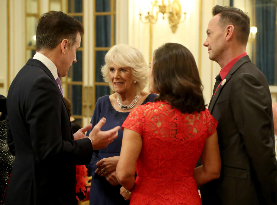 Embargoed to 0001 Saturday December 23 The Duchess of Cornwall, President of the National Osteoporosis Society, talks to 'Strictly Come Dancing' dancer Anton du Beke (left) with judges Shirley Ballas and Craig Revel Horwood as she hosts a tea dance at Buckingham Palace in London attended by 'Strictly Come Dancing' dancers and judges to highlight the benefits for older people of staying active.