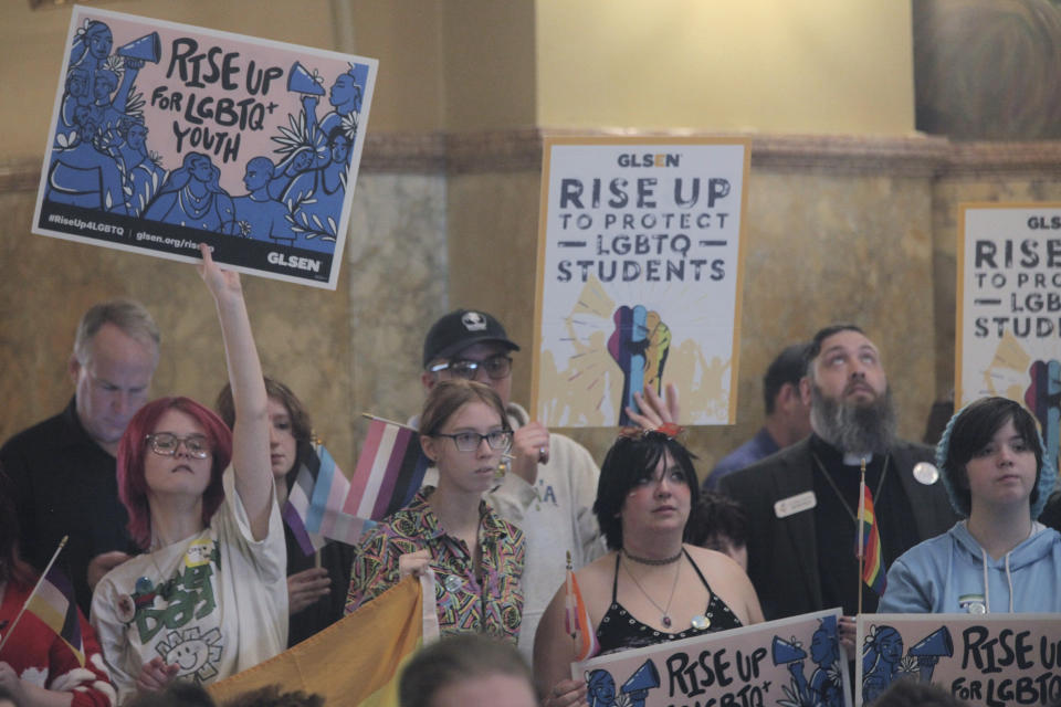 In this photo from Wednesday, Jan. 31, 2024, high school students and their sponsors rally for LGBTQ+ rights at the Kansas Statehouse in Topeka, Kan. Republican legislators are close to enacting a ban on gender-affirming care for transgender minors over Democratic Gov. Laura Kelly's veto. (AP Photo/John Hanna)