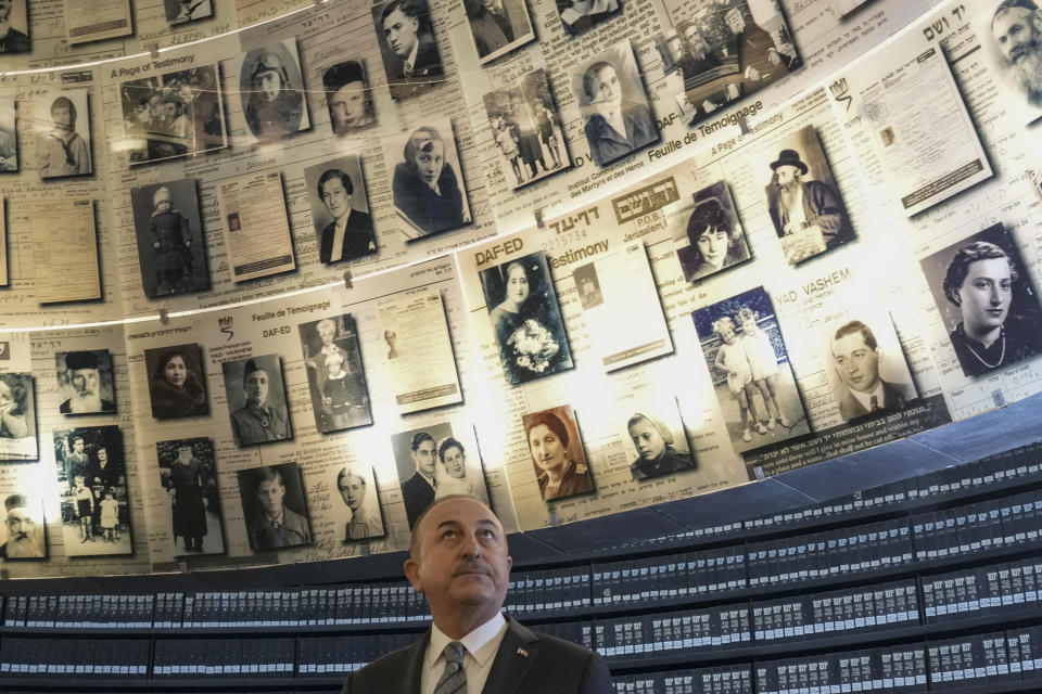 Turkish Foreign Minister Mevlut Cavusoglu visits the Hall of Names in the Yad Vashem World Holocaust Remembrance Center in Jerusalem, Wednesday, May 25, 2022. (AP Photo/ Maya Alleruzzo)