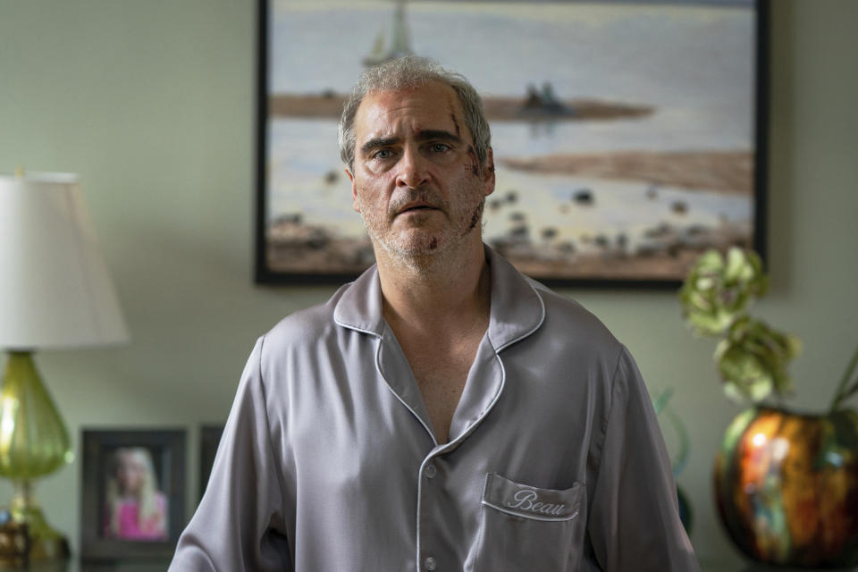 This image released by A24 shows Joaquin Phoenix in a scene from "Beau is Afraid." (Takashi Seida/A24 via AP)