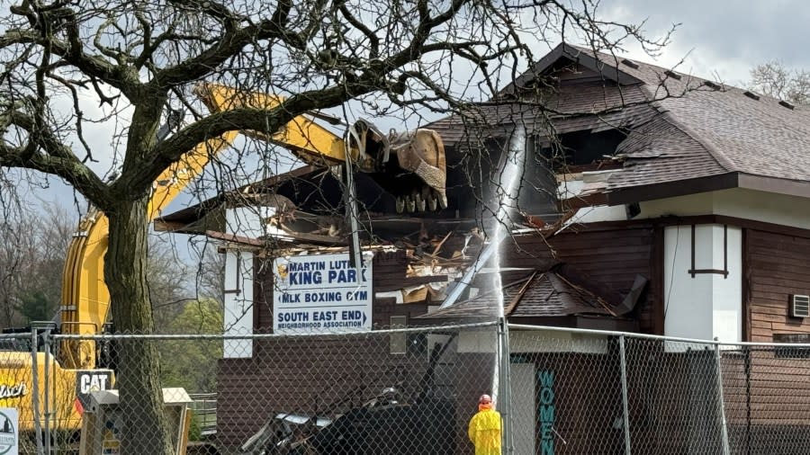 Crews begin tearing down the lodge at Martin Luther King Park on April 17, 2024.