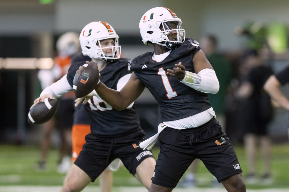 FILE - Miami quarterback Cam Ward (1) prepares to throw during NCAA college football practice in Coral Gables, Fla., Monday, March 4, 2024. Ward played his first spring game with the Hurricanes on Saturday, April 13, 2024. The Washington State transfer hasn't wasted any time becoming the full-fledged leader of a Miami team hoping to contend for a college football playoff spot in 2024. (Matias J. Ocner/Miami Herald via AP, File)