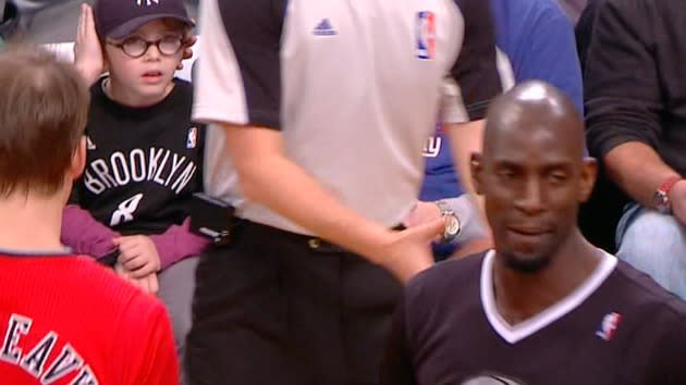 A boy protects his younger brother from Kevin Garnett's language and ...