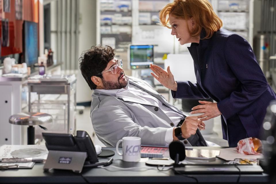 Villainous businesswoman Victoria Kord (Susan Sarandon) threatens her scientist Dr. Sanchez (Harvey Guillén) in "Blue Beetle."