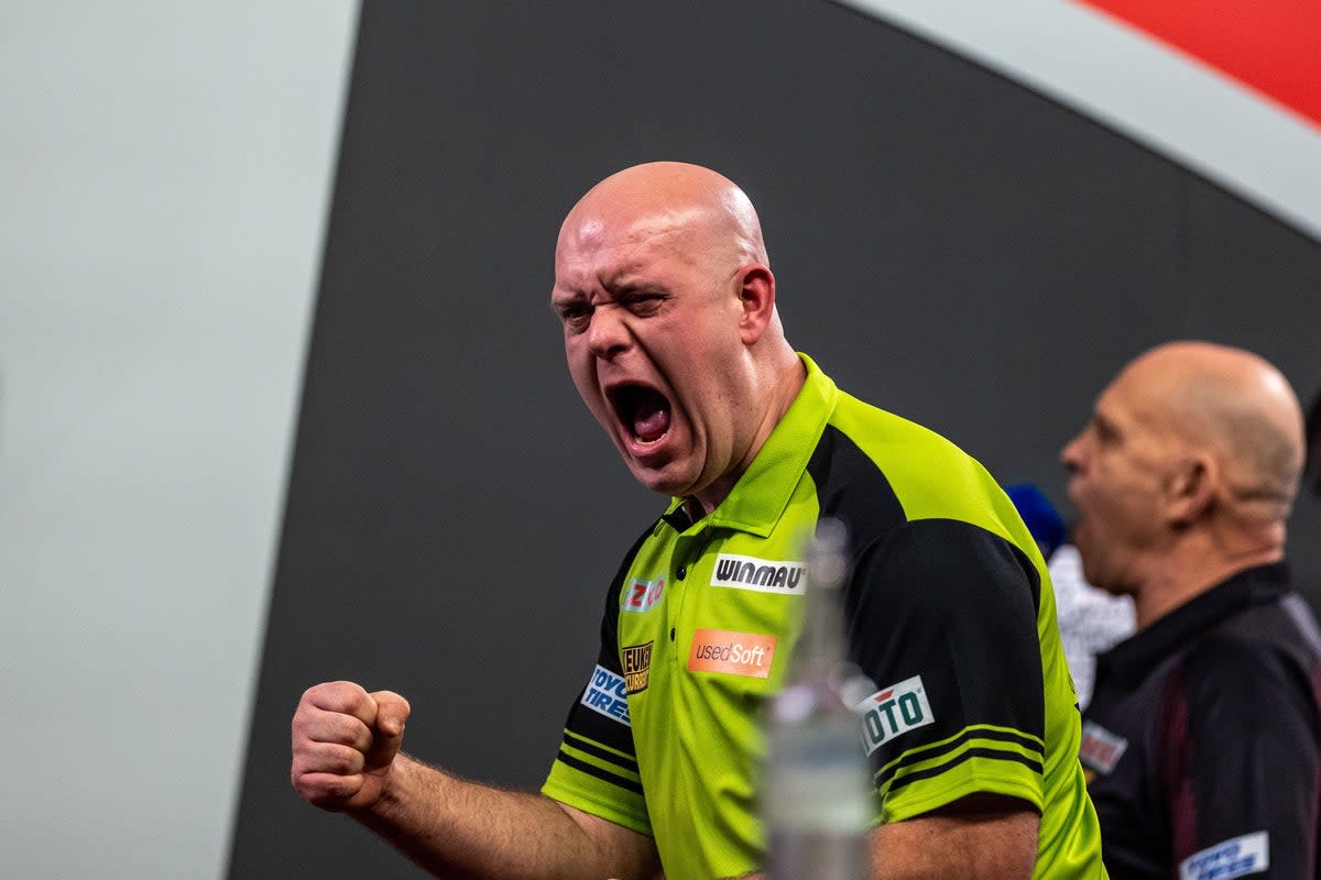 Michael van Gerwen celebrates after beating Dirk van Duijvenbode 4-1 (Steven Paston/PA). (PA Wire)