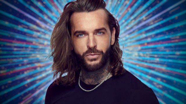 Pete Wicks in a black outfit