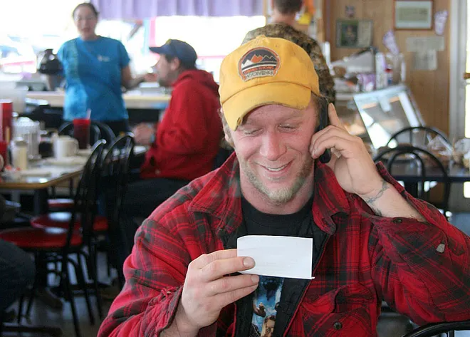 A happy customer enjoys free breakfast at Mama's House in Holland.