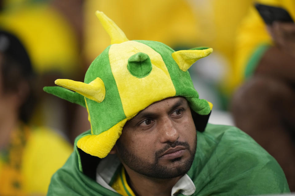 A Brazil soccer fan reacts at the end of the World Cup quarterfinal soccer match between Croatia and Brazil, at the Education City Stadium in Al Rayyan, Qatar, Friday, Dec. 9, 2022. (AP Photo/Darko Bandic)