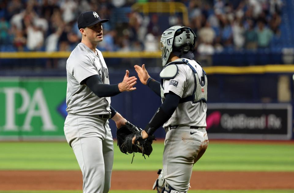 May 10, 2024; St. Petersburg, Florida, USA; New York Yankees pitcher Clay Holmes (35) and catcher Jose Trevino (39) celebrate after they beat the Tampa Bay Rays at Tropicana Field. Mandatory Credit: Kim Klement Neitzel-USA TODAY Sports