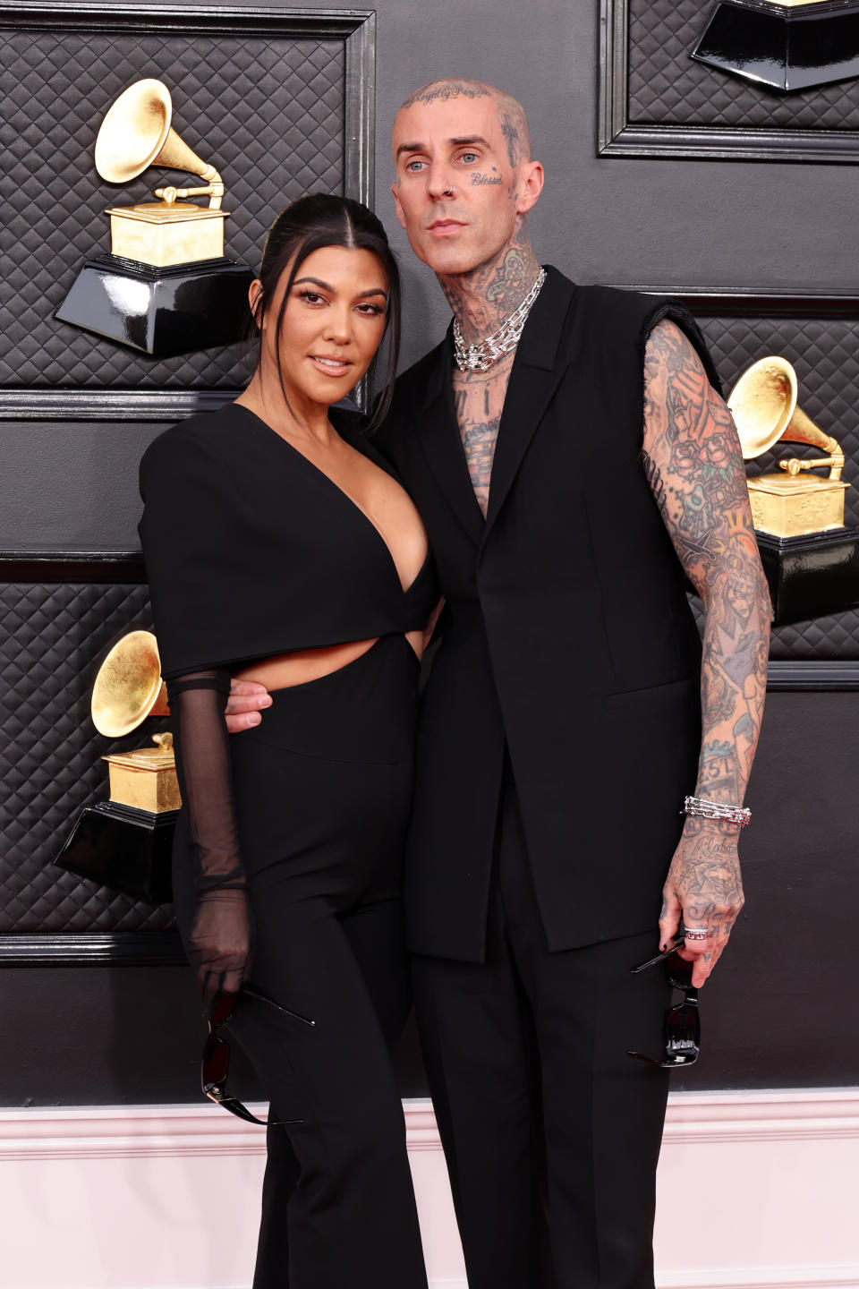 LAS VEGAS, NEVADA - APRIL 03: (L-R) Kourtney Kardashian and Travis Barker attend the 64th Annual GRAMMY Awards at MGM Grand Garden Arena on April 03, 2022 in Las Vegas, Nevada. (Photo by Amy Sussman/Getty Images)