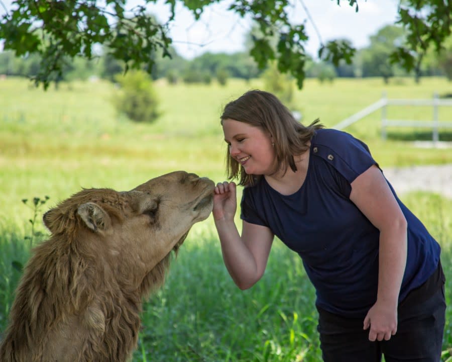 KETK reporter and weekend anchor Tori Bean gets a kiss from Jaba the camel