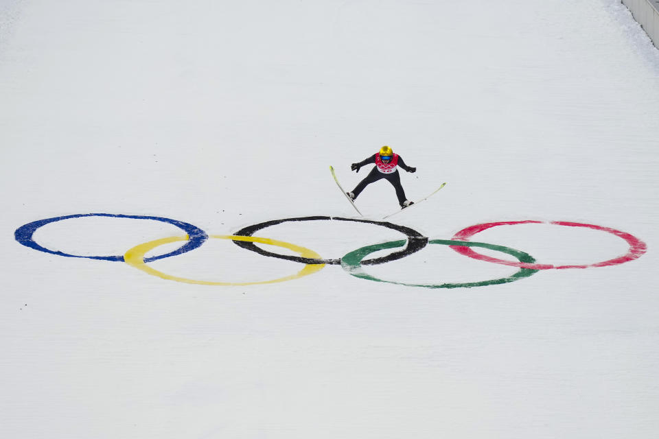 Jarl Magnus Riiber, of Norway, soars through the air during the competition round of the individual Gundersen large hill/10km ski jumping competition at the 2022 Winter Olympics, Tuesday, Feb. 15, 2022, in Zhangjiakou, China. (AP Photo/Matthias Schrader)