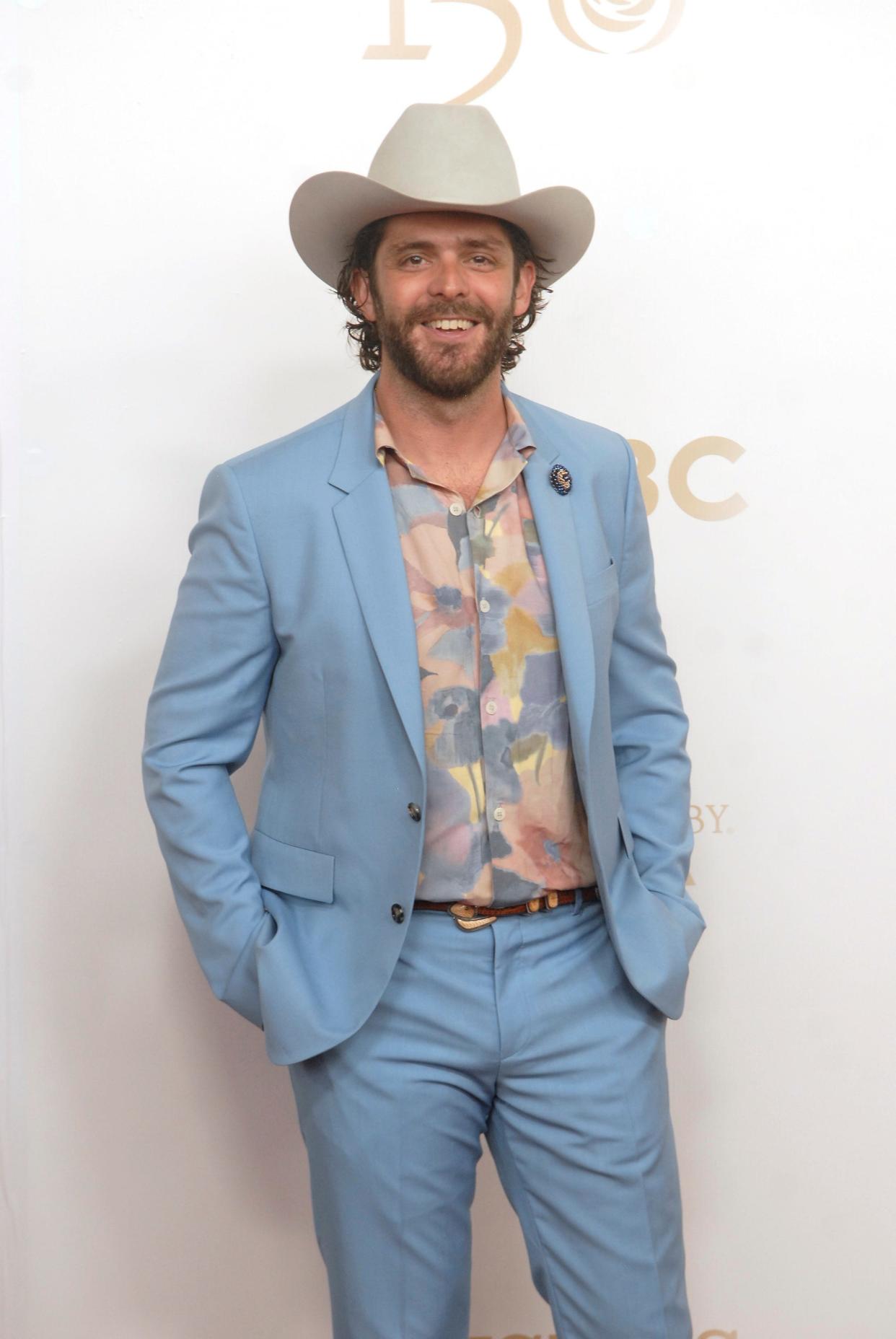 Country singer Thomas Rhett, left, poses on the 150th Kentucky Derby red carpet Saturday. May 04, 2024