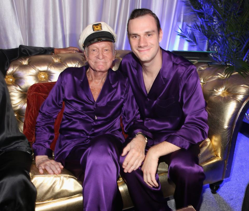 Hugh Hefner and son Cooper Hefner at the publisher's annual Midsummer Night's Dream party at the Playboy Mansion in 2014.