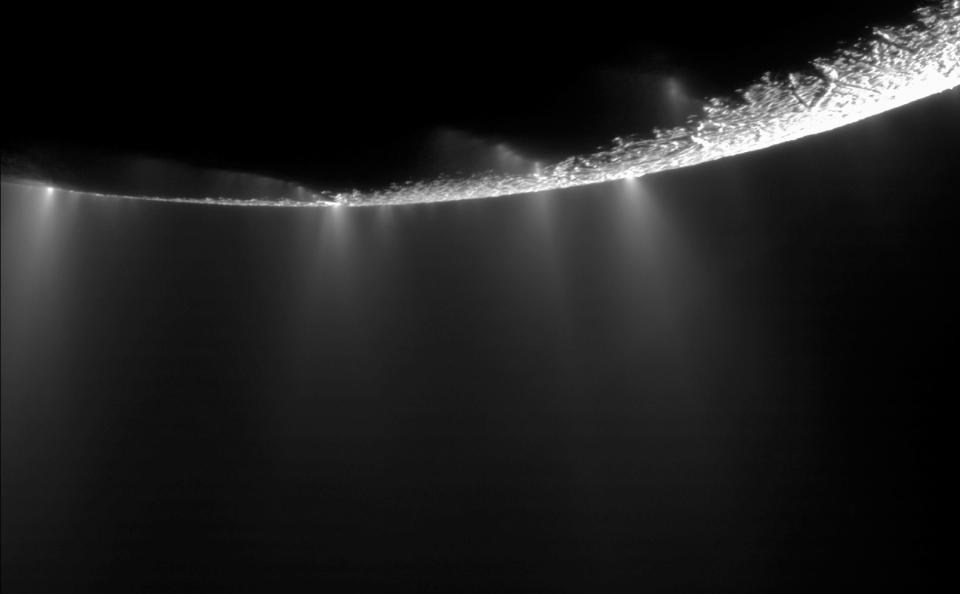 This photo provided by NASA shows water vapor jets, emitted from the southern polar region of Saturn's moon Enceladus. Scientists have uncovered a vast ocean beneath the icy surface of the moon, they announced Thursday, April 3, 2014. Italian and American researchers made the discovery using Cassini, a NASA-European spacecraft still exploring Saturn and its rings 17 years after its launch from Cape Canaveral. (AP Photo/NASA, JPL, Caltec, Space Science Institute)