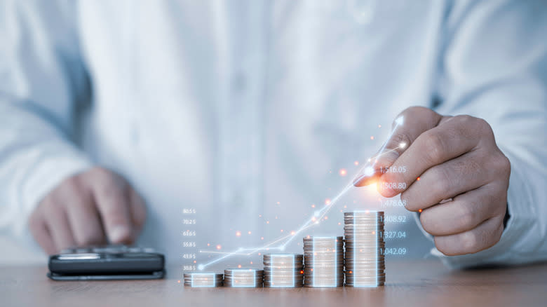 money graph with coin stacking