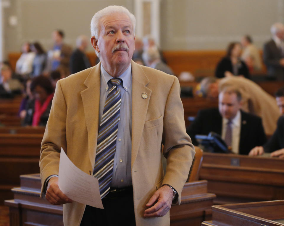 Rep. Ray Merrick, R-Stilwell, and the Speaker of the Kansas House of Representatives looks at the vote board during today's session at the Kansas Statehouse in Topeka, Kan., Friday, Feb. 14, 2014. Senate President Susan Wagle said the bill, which was approved Wednesday in the Kansas House, goes beyond protecting religious freedom. She raised concerns about discrimination and how it could impact businesses that would refuse services to gay couples. (AP Photo/Orlin Wagner)